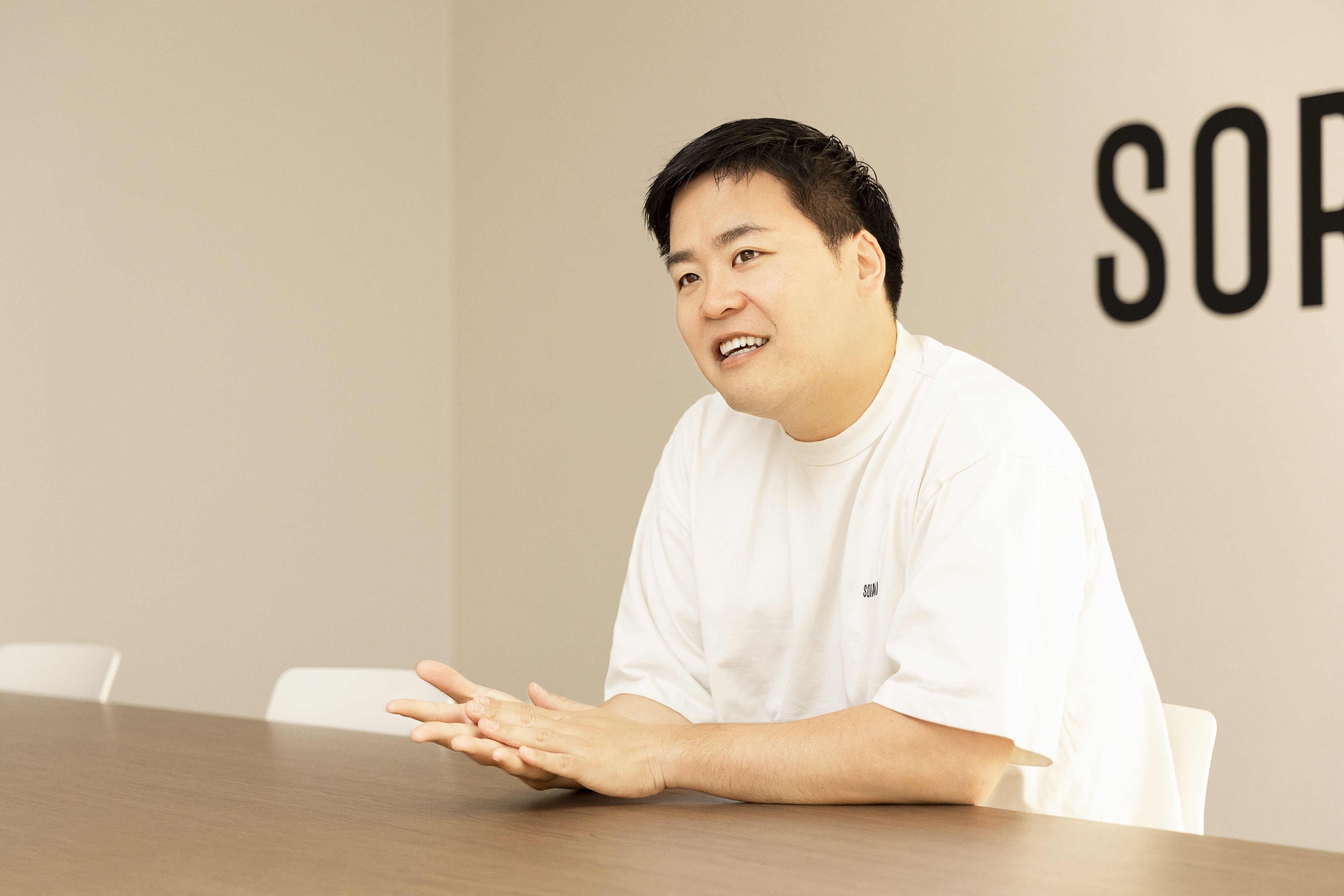 image of hagiwara smiling in interview style set up